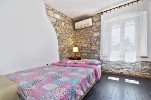 Postel nebo postele na pokoji v ubytování Apartmani Anna