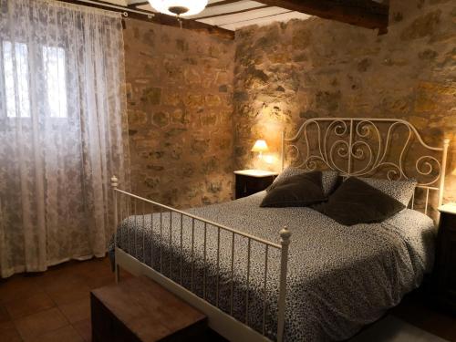 A bed or beds in a room at Casa Sigüenza