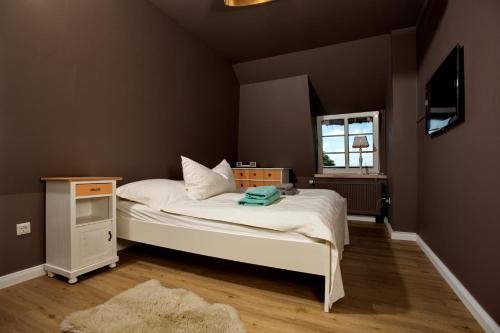 Tempat tidur dalam kamar di "Lütt Lori"