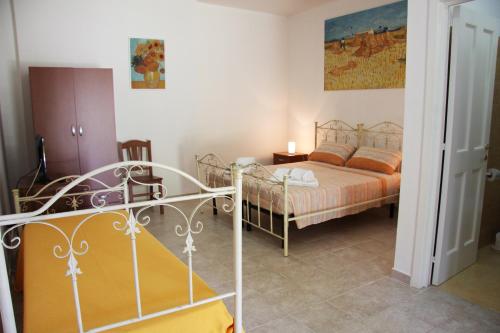 Кровать или кровати в номере Il Casale di zio Marco