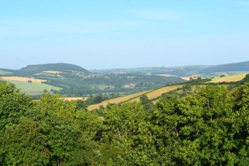 a view of the rolling hills and trees at Little Drift in Edgton