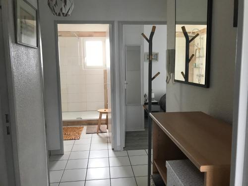 a kitchen with a bathroom with a sink and a mirror at Clos ETCHBERRI in Bidart