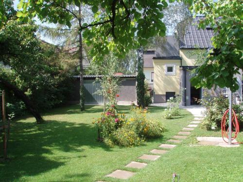 a garden with some flowers in the grass at Ferienhaus Burgenland in Mönchhof