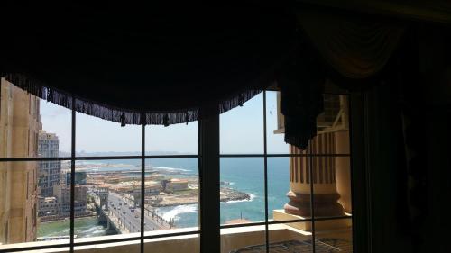 a view of the ocean from a window at Stanley Bridge Apartment in Alexandria