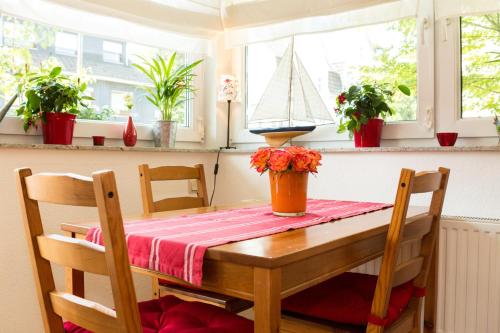 a dining room table with a boat on top of it at Ferienwohnung Mittendrin in Bergisch Gladbach