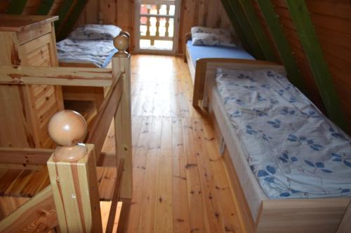 Giường trong phòng chung tại Osrodek Nadmorski Osieki