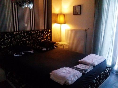 A bed or beds in a room at Greek hospitality 2
