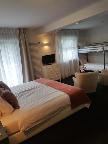 Łóżko lub łóżka w pokoju w obiekcie Hotel Herrloh