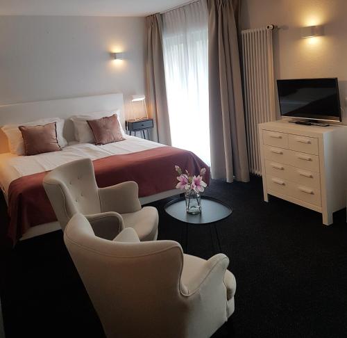 Łóżko lub łóżka w pokoju w obiekcie Hotel Herrloh