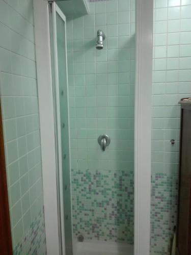 a shower with a glass door in a bathroom at B&B Casa Armonia in Pizzo