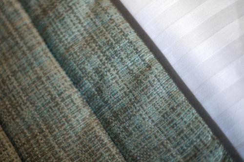 a close up of the seat of a couch at Carré Pau Airport Hôtel in Serres-Castet