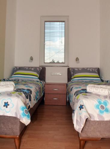 Katil atau katil-katil dalam bilik di Comfort Apartment
