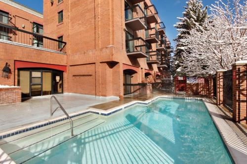 a swimming pool in front of a building at Shadow Ridge in Park City