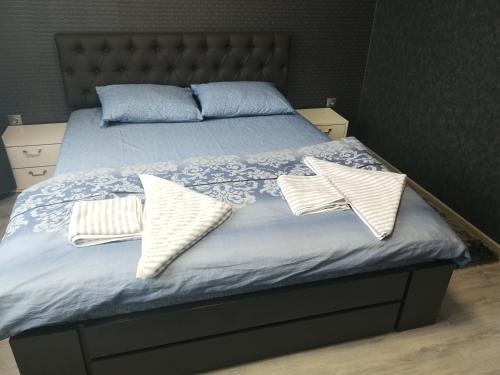 Giường trong phòng chung tại Misha