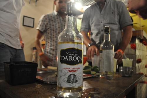 a bottle of wine sitting on a table in a kitchen at Mango Tree Ipanema in Rio de Janeiro