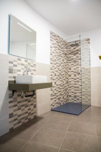 a bathroom with a sink and a shower at Hotel Salambina in Salobreña