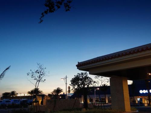 a view of a parking lot at night at La'gent Hotel Okinawa Chatan Hotel and Hostel in Chatan
