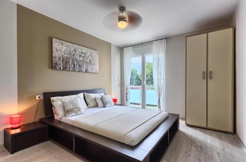 Posteľ alebo postele v izbe v ubytovaní Villa Anadi