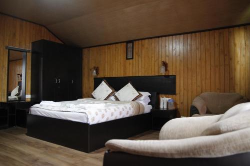 Postel nebo postele na pokoji v ubytování Vamoose Mandarin Village Resort