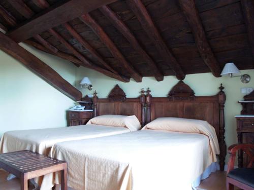 Katil atau katil-katil dalam bilik di Hotel Rural Casa Roja