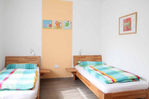 Postel nebo postele na pokoji v ubytování Feriendorf Nehmeier