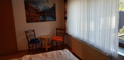 Postel nebo postele na pokoji v ubytování Ferienwohnung Haus Kapellenblick