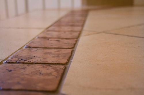 a row of chocolate bars on a tile floor at Villa Wellness Homes in Mötz