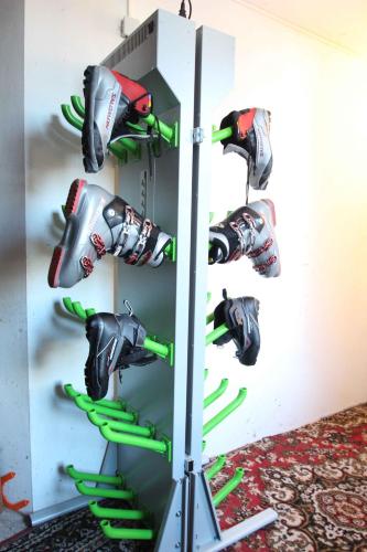 a wall mounted shoe rack with skis in a wall at Villa Wellness Homes in Mötz