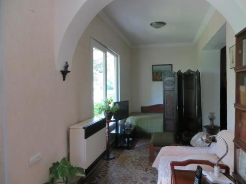 Un pat sau paturi într-o cameră la Guest House Kamea