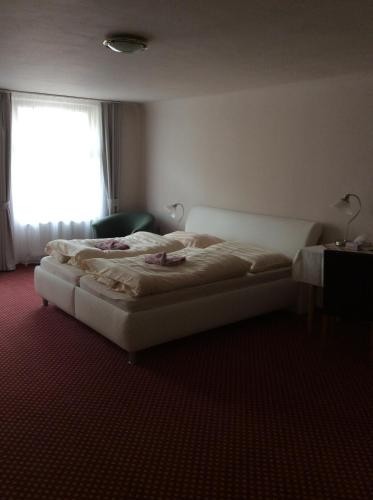Ένα ή περισσότερα κρεβάτια σε δωμάτιο στο Hotel U Zlateho Andela