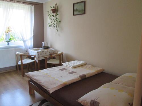 A bed or beds in a room at U Jurka