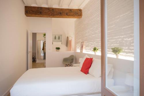 A bed or beds in a room at El Mirador de la Cuesta de Santo Domingo