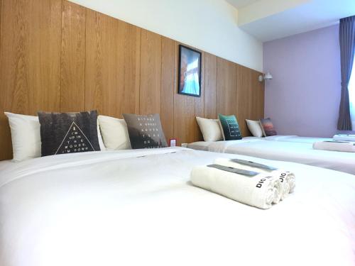 Postel nebo postele na pokoji v ubytování Kenting Dio Inn