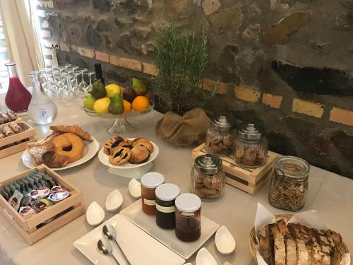 a table with many different types of food on it at I Casali della Parata in Velletri