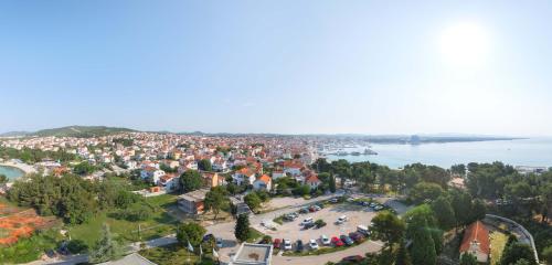 an aerial view of a town next to the water at Hotel Punta in Vodice