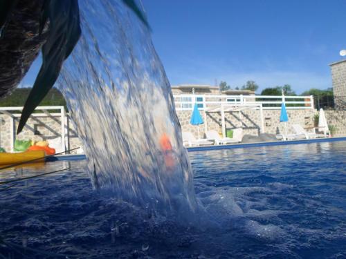 a close up of a water fountain in a pool at Luštica Apartments in Lustica
