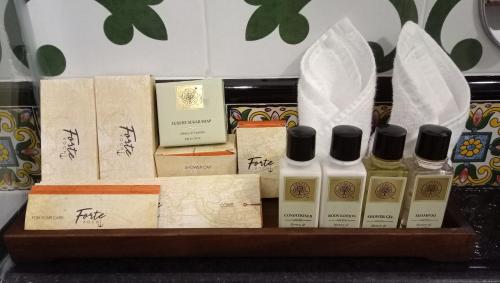 a shelf with a bunch of bottles of perfume at Forte Kochi in Cochin