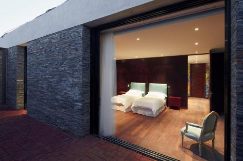 Un pat sau paturi într-o cameră la Playa Vik Jose Ignacio