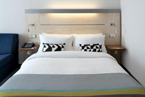 Ένα ή περισσότερα κρεβάτια σε δωμάτιο στο Holiday Inn Express Singen by IHG