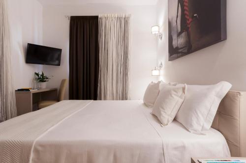 Cama o camas de una habitación en Alexandra Hotel