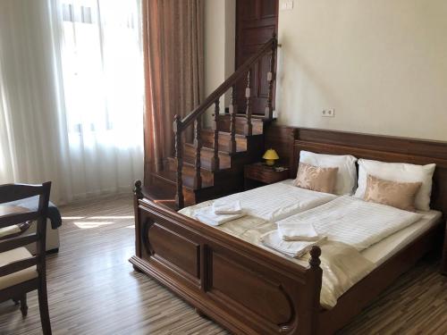 Postel nebo postele na pokoji v ubytování Mosoly Apartman