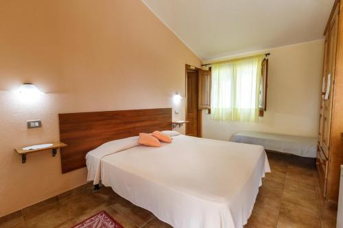 Postel nebo postele na pokoji v ubytování Agriturismo Su Solianu