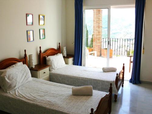 A bed or beds in a room at Villa El Gallo