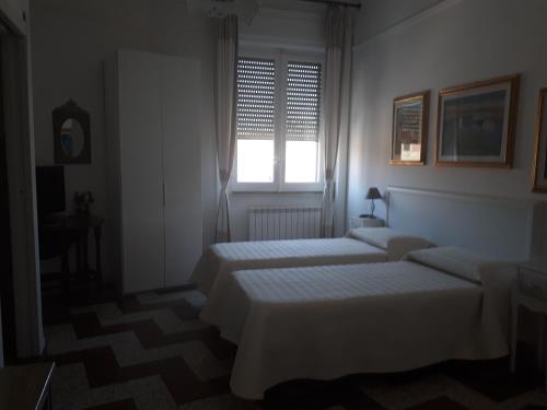 Cama o camas de una habitación en Dante Alighieri Guest House