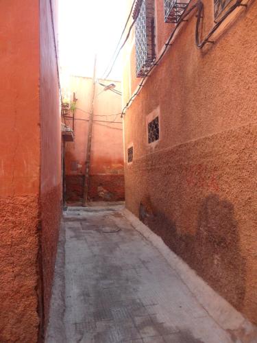 an alley between two buildings in an alley way at Dar Sohane in Marrakesh