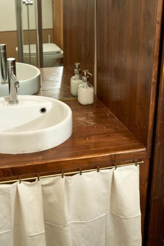 a bathroom with a sink and a mirror and towels at Centro Storico in Chiari