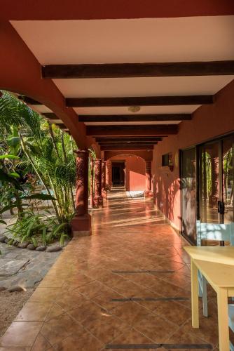 a hallway of a house with a tile floor at Boutique Surf Hotel Rip Jack Inn in Playa Grande