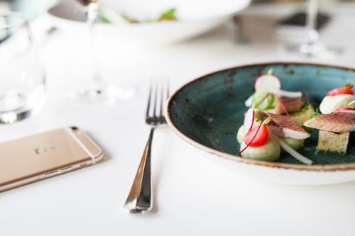 a bowl of food on a table with a fork at Mooirivier in Dalfsen