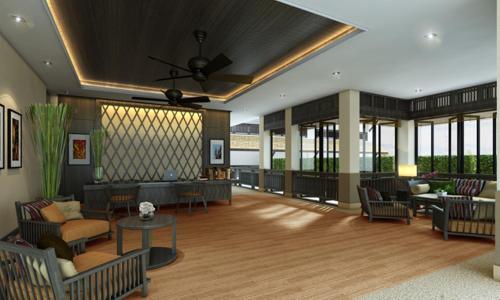 a living room with couches and tables and windows at Panya Resort Hotel in Udon Thani