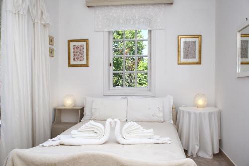 Ένα ή περισσότερα κρεβάτια σε δωμάτιο στο Villa Karidia